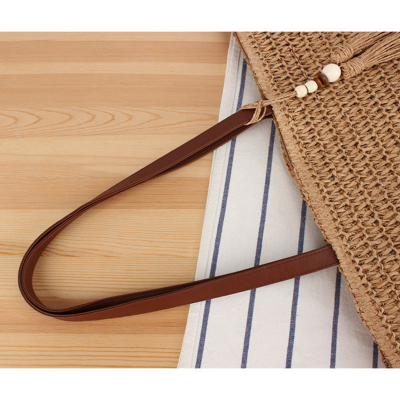 Handtasche Aus Geflochtenem Naturmaterial mit Quastenverzierung Brehn