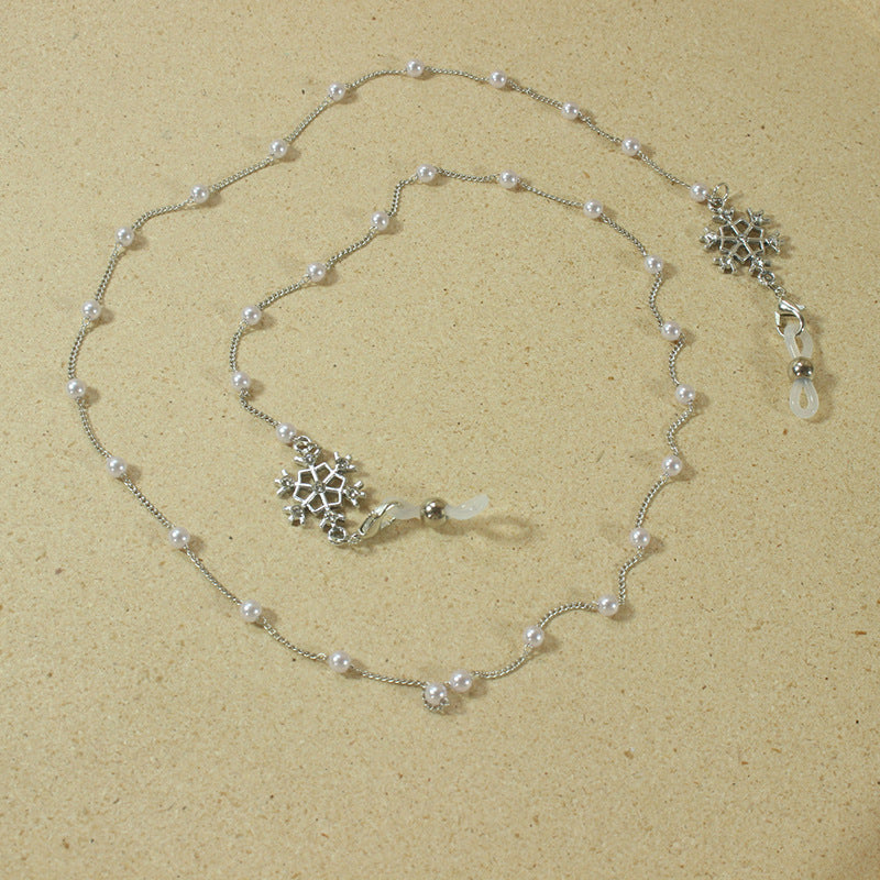 Elegante Brillenhalterkette mit Perlen und Schneeflockenanhänger Brehn
