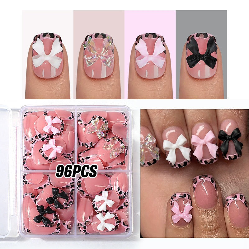 Kunstnagelset mit beeindruckenden Blumen- und Schleifenakzenten Brehn