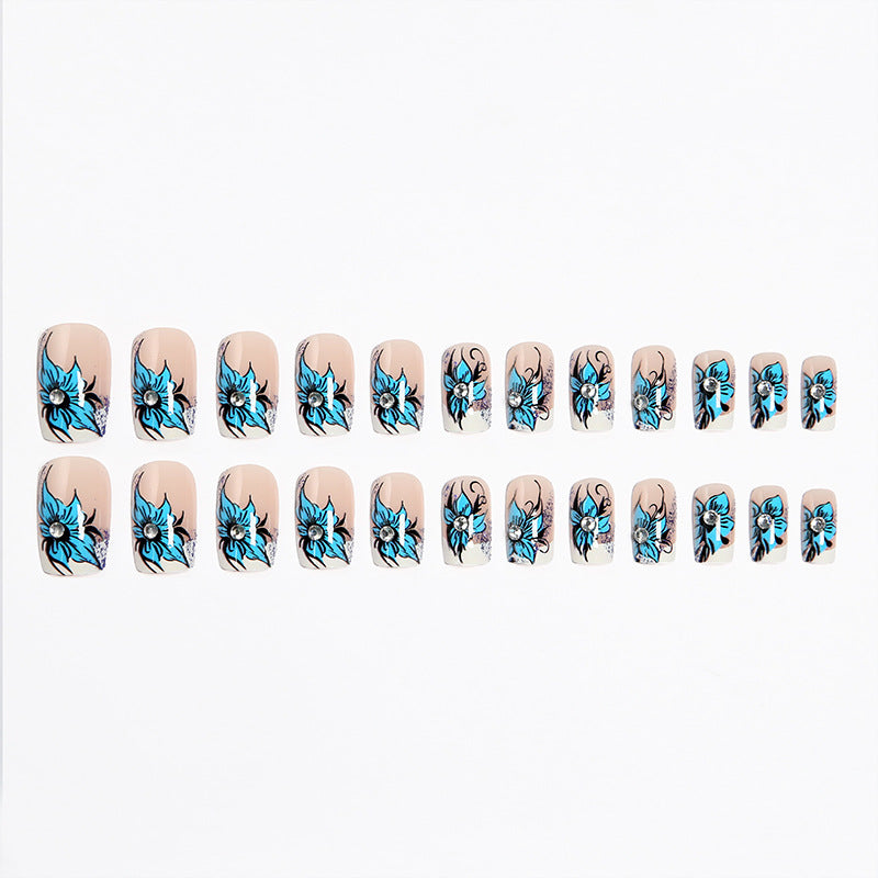 Kunstnagelset mit detailreichen floralen Designs und Glitzerelementen Brehn