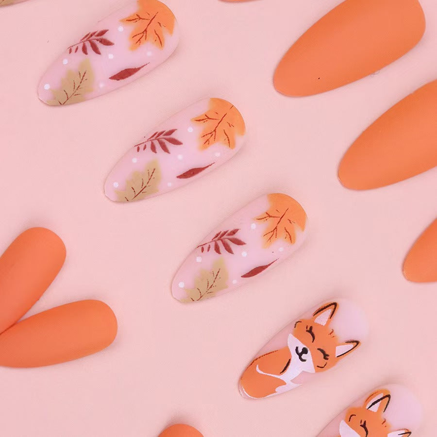 Künstlerisches Press-On-Nagelset mit floralem und Charakterdesign Brehn