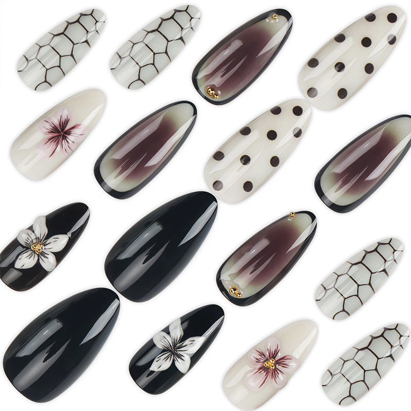 Künstlerisches Stiletto Press-On Nagelset mit Punkten und floralen Designs Brehn