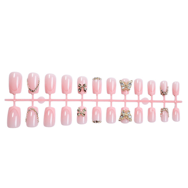 Glamouröses Kunstnagelset mit floralen Akzenten und Glitzerverzierungen Brehn