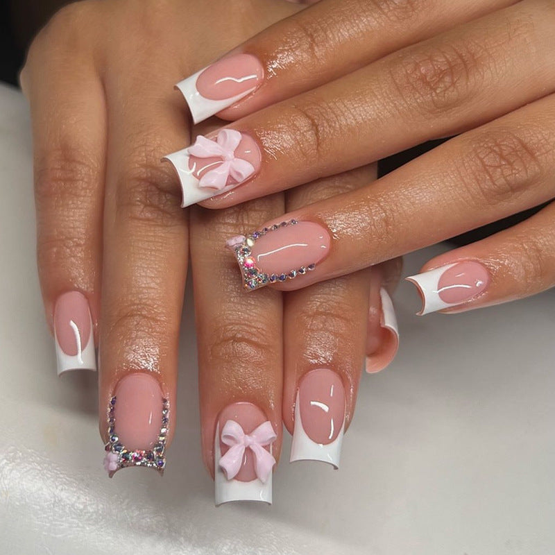 Kunstnagelset mit eleganten Schleifen- und Glitzerdesigns Brehn