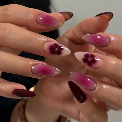 Kunstvolle Nagelkunst mit Ombre-Design und floralen Akzenten Brehn