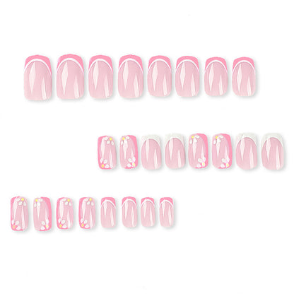 Kunstvolle Nagelkunst mit floralem Design und Glitzerakzenten Brehn