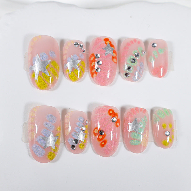 Kunstnagelset mit kreativen Designs und Glitzerakzenten Brehn
