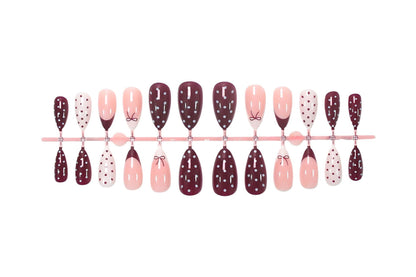 Kunstnagelset mit eleganten Schleifen- und Punktemotiven Brehn