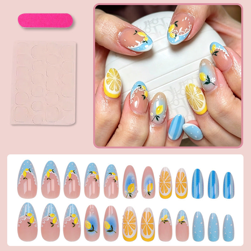 Kunstnagelset mit fröhlichen Zitrus- und Blumenmotiven Brehn
