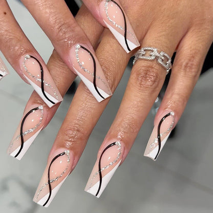 Kunstvolle Nagelverlängerungen mit elegantem Glitzerdesign Brehn