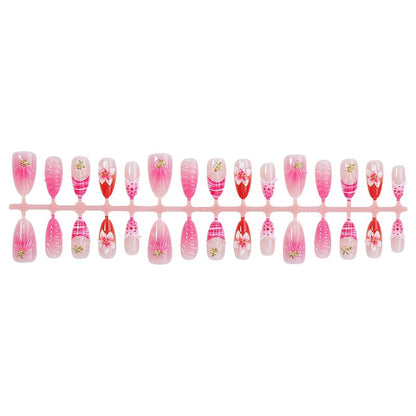Kunstnagelset mit blühenden 3D-Details und Glitzerakzenten Brehn