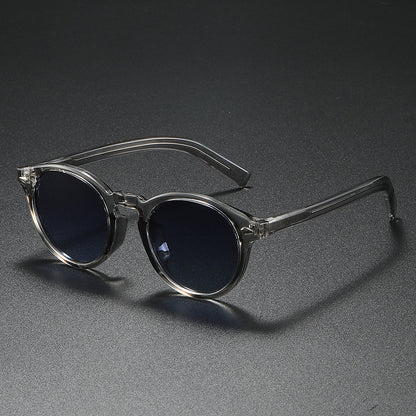 Damen Rund-Sonnenbrille mit transparentem Rahmen und reflektierenden Gläsern Brehn