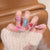 Künstlerisches Press-On-Nagelset mit floralen und abstrakten Designs Brehn