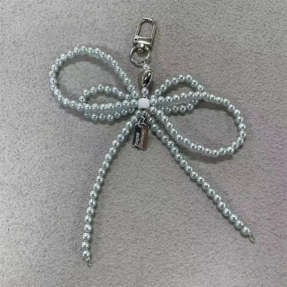 Elegante Perlenbogen Schlüsselanhänger Brehn
