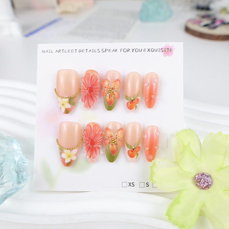 Kunstnagelset mit romantischen Blüten und fruchtigen Akzenten Brehn