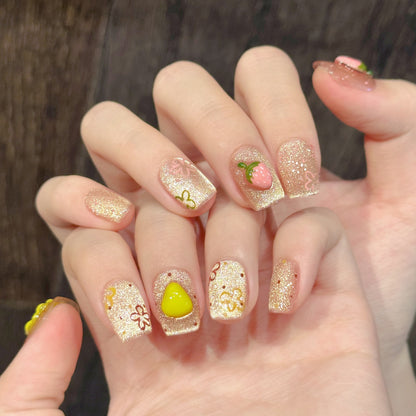 Dekoratives Press-On Nagelkunst-Set mit glitzernden Fruchtdesigns