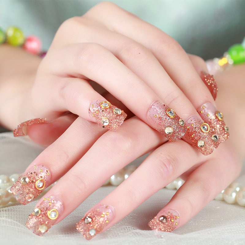 Kunstnägel mit elegantem Blumen- und Strassdesign Brehn