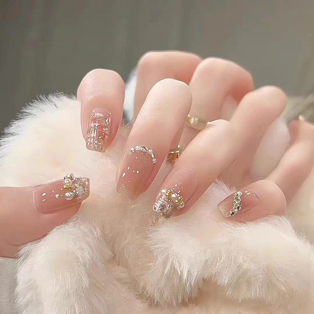 Dekorative Press-On Nagelverlängerungen mit Schleifen- und Strassakzenten Brehn