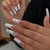 Kunstnagelset mit glamourösen Spitzenverzierungen und eleganten Akzenten Brehn