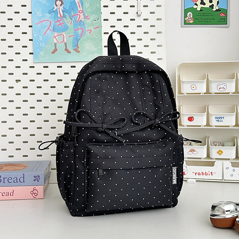 Süßer gepunkteter Studentenschulrucksack