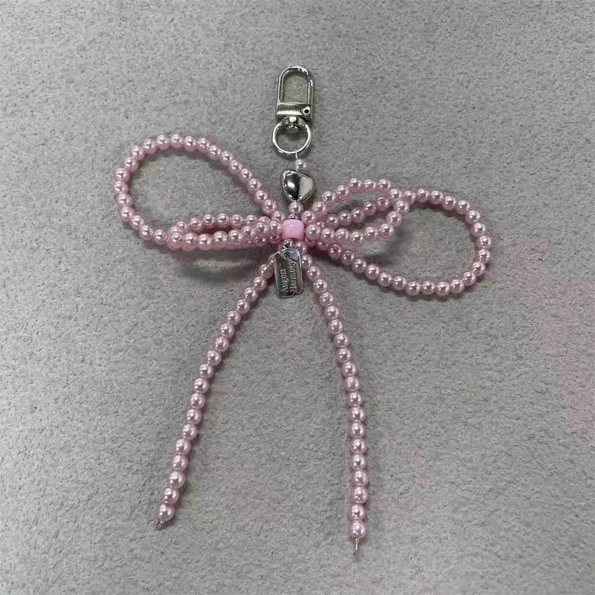 Elegante Perlenbogen Schlüsselanhänger Brehn