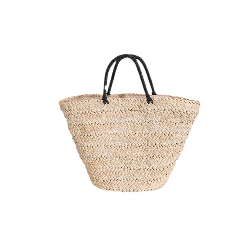 Elegante Basttasche mit Kontrastgriffen Brehn