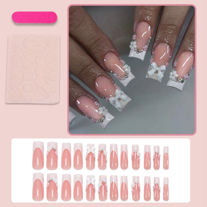 Kunstnagelset mit eleganten Schleifen und Glitzerakzenten Brehn
