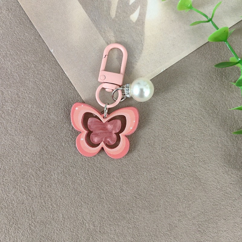 Schlüsselanhänger mit Schmetterling und Perlenakzent Brehn
