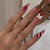 Kunstnagelset mit festlichen Schleifen- und Streifenmotiven Brehn