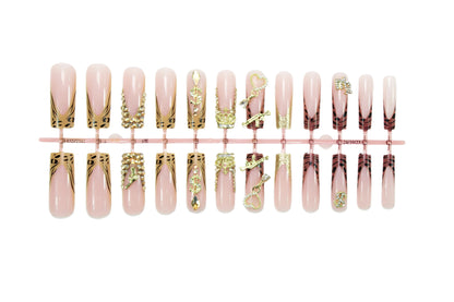 Kunstnagelset mit eleganten goldenen und tierischen Verzierungen Brehn