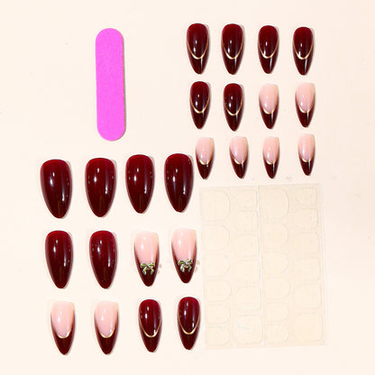 Elegante Stiletto-Nagelkunstverlängerungen mit goldenen Akzenten Brehn