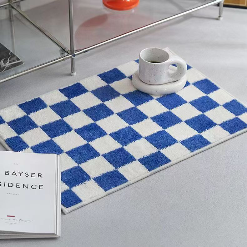 Schwarzweiß kariertes Badevorleger