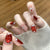 Künstlerisches Press-On Nail Set mit Glitzer und Sternelementen Brehn