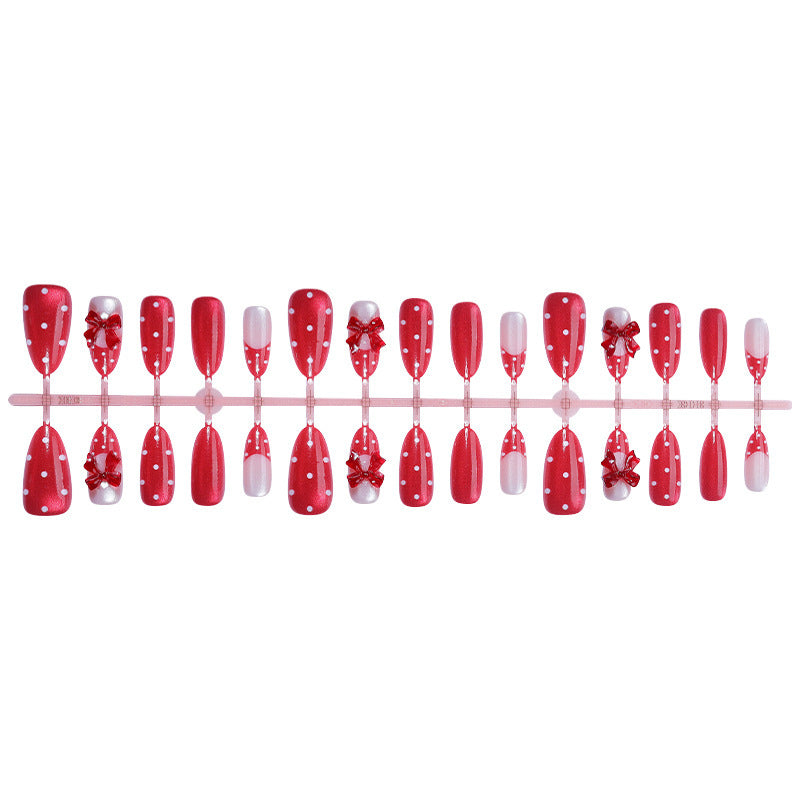 Charmantes dekoratives Press-On Nagelkunstset mit Schleifen- und Punkten-Design Brehn