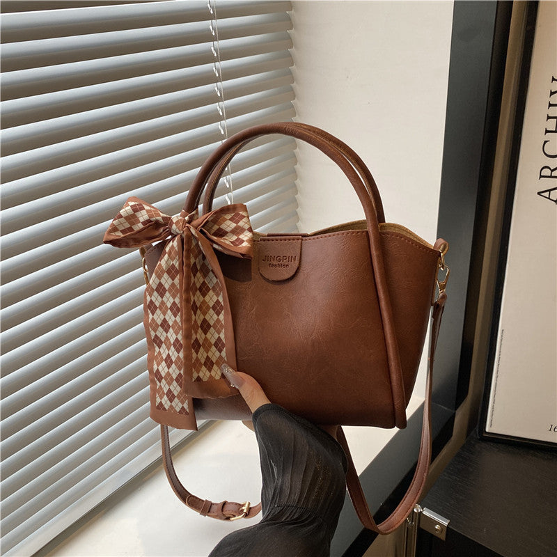 Elegante Schleifenakzent-Handtasche Brehn