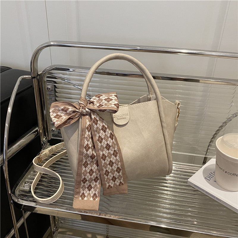 Elegante Schleifenakzent-Handtasche Brehn