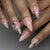 Elegantes Press-On Nail Set mit künstlerischen silbernen Akzenten Brehn