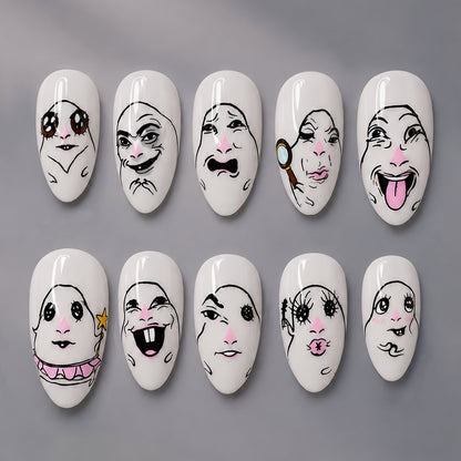 Kreatives Kunstnagelset mit Gesichtsmotiven Brehn