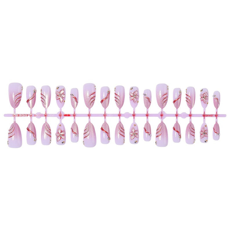 Kunstnagelset mit eleganten Blüten- und Glitzermotiven Brehn