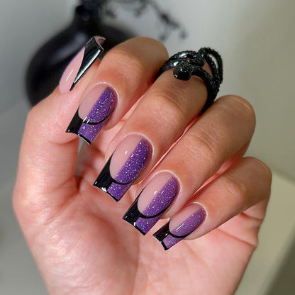 Kunstvolle Nagelverlängerungen mit glamourösem Farbverlauf und Glitzerdetails Brehn