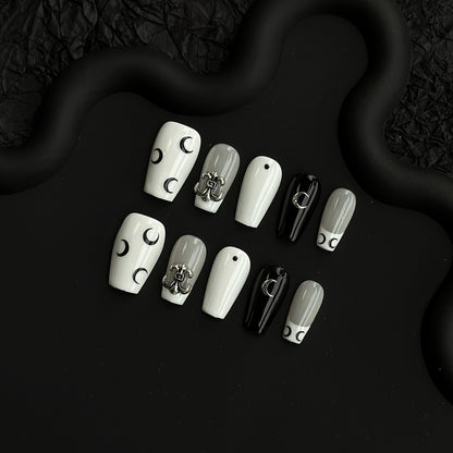 Künstlerisches Press-On Nagelkunstset mit eleganten Mond- und Stern-Designs