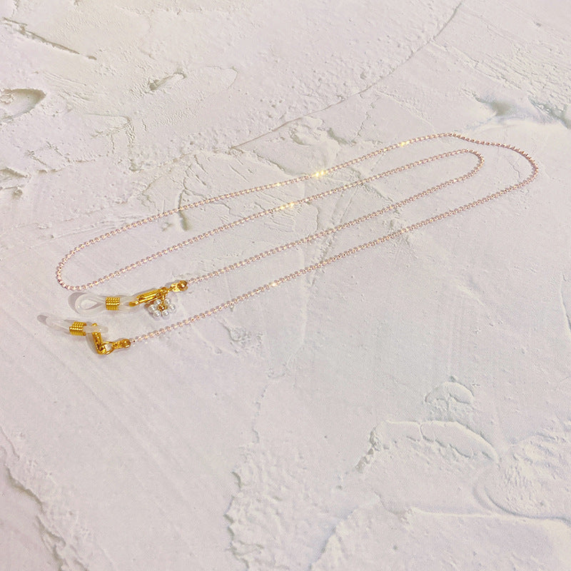Kettenbrillenband mit Perlen und Goldanhängern Brehn
