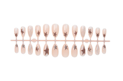 Kunstnagelset mit eleganten Sternenmotiven und Glitzerakzenten Brehn