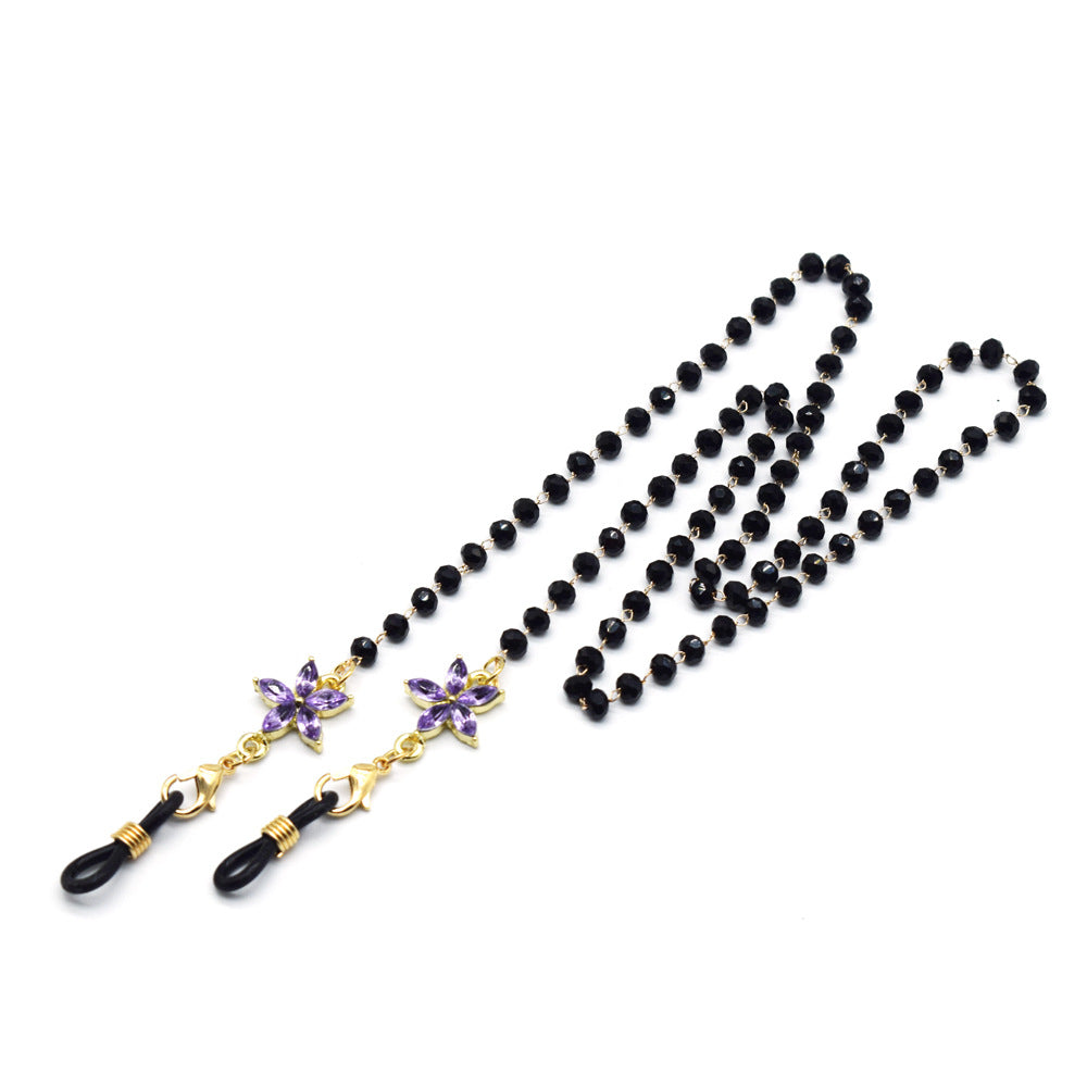 Eleganter mit Blumenakzenten verzierter Brillenketten Brehn