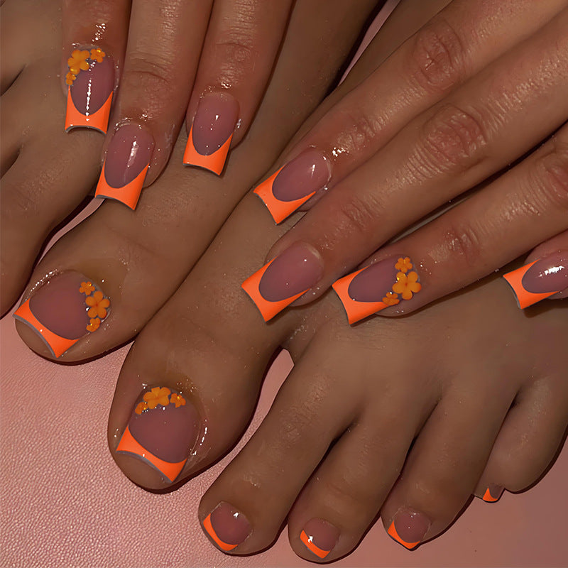 Kunstnagelset mit stilvollen orangen Neon-Akzenten Brehn