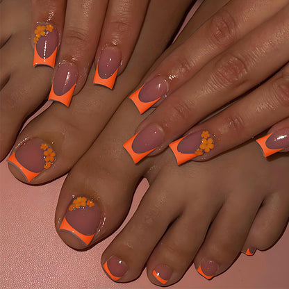 Kunstnagelset mit stilvollen orangen Neon-Akzenten Brehn