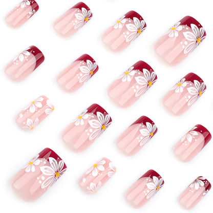 Kunstvolle Nagelverlängerungen mit Blumenmotiv Brehn