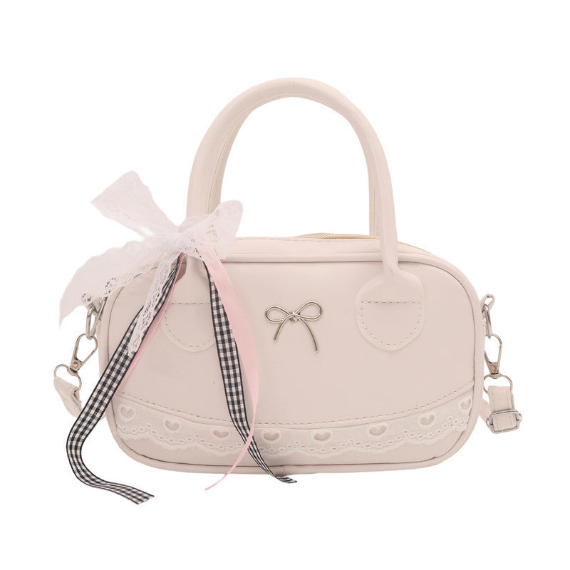 Elegante mit Spitzenbesatz verzierte Bogenhandtasche Brehn