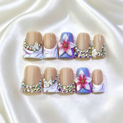 Dekoratives florales Nagelkunstset mit Strassteinen