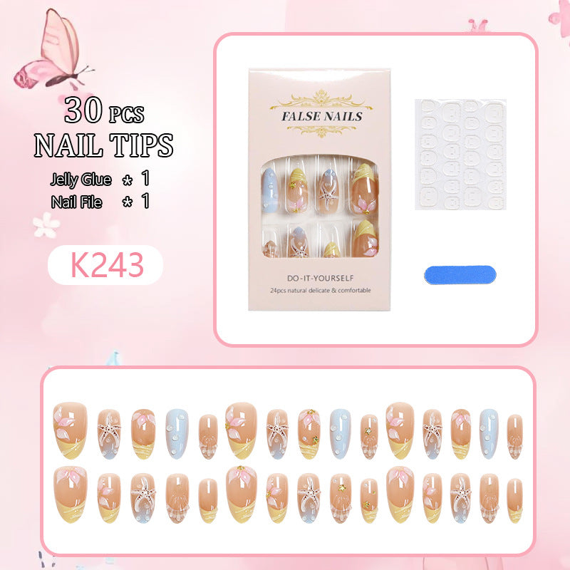 Kunstnägel mit floralen Motiven und Glitzerdetails Brehn